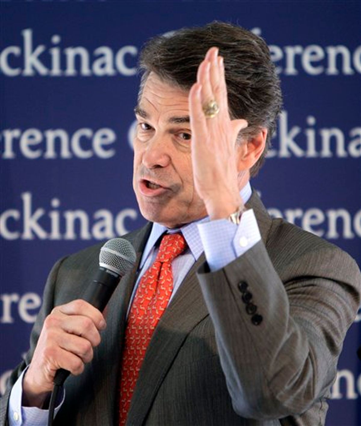 Republican presidential candidate Texas Gov. Rick Perry addresses the Republican Leadership Conference at the Grand Hotel on Mackinac Island, Mich., Saturday, Sept. 24, 2011. (AP Photo/Carlos Osorio)  (AP)