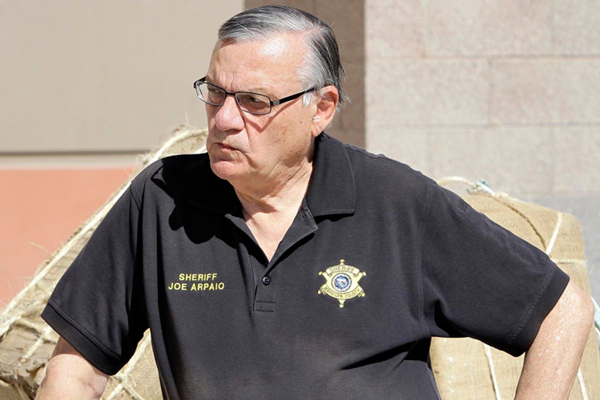 Maricopa County Sheriff Joe Arpaio, showcasing 2,300 lbs of seized marijuana, waits to address the media Thursday, May 12 2011 outside the Sheriff's training center in Phoenix. Sheriff Arpaio confirms two agents were killed in a freight train collision. And he says the FBI will be taking over the investigation. (AP Photo/Matt York)  (Matt York)