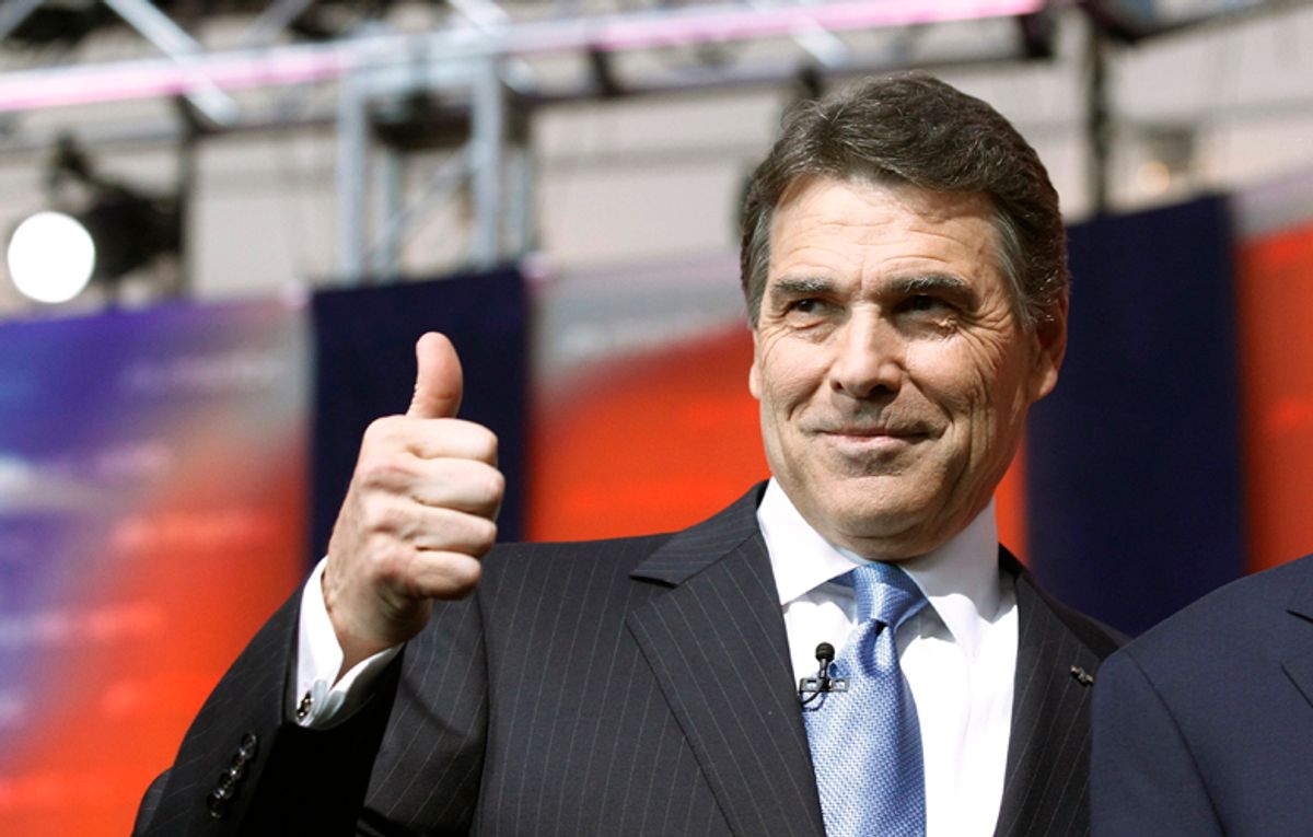 Texas Governor Rick Perry gives a thumbs up as he stands on stage before the Reagan Centennial GOP presidential primary debate at the Ronald Reagan Presidential Library in Simi Valley, California September 7, 2011.  REUTERS/Mario Anzuoni (UNITED STATES  - Tags: POLITICS) (Â© Mario Anzuoni / Reuters)