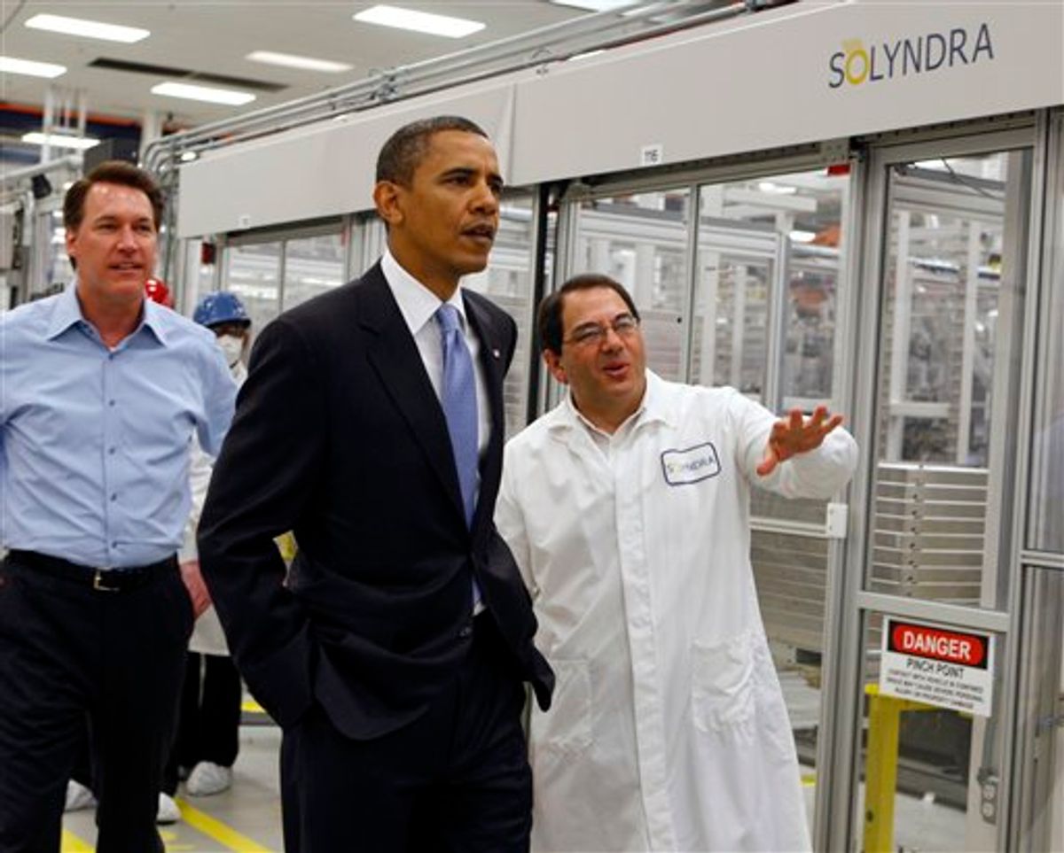 FILE - In this May 26, 2010 file photo, President Obama, center, is given a tour of Solyndra by Executive Vice President Ben Bierman, right, as Chief Executive Officer Chris Gronet, left, walks along at Solyndra Inc. in Fremont, Calif. FBI spokesman Peter Lee says agents executed multiple search warrants on Thursday morning  Sept. 8, 2011 at the company's headquarters in Fremont as part of an investigation with the Department of Energy's Office of Inspector General. (AP Photo/Paul Chinn, Pool, File) (AP/Paul Chinn)