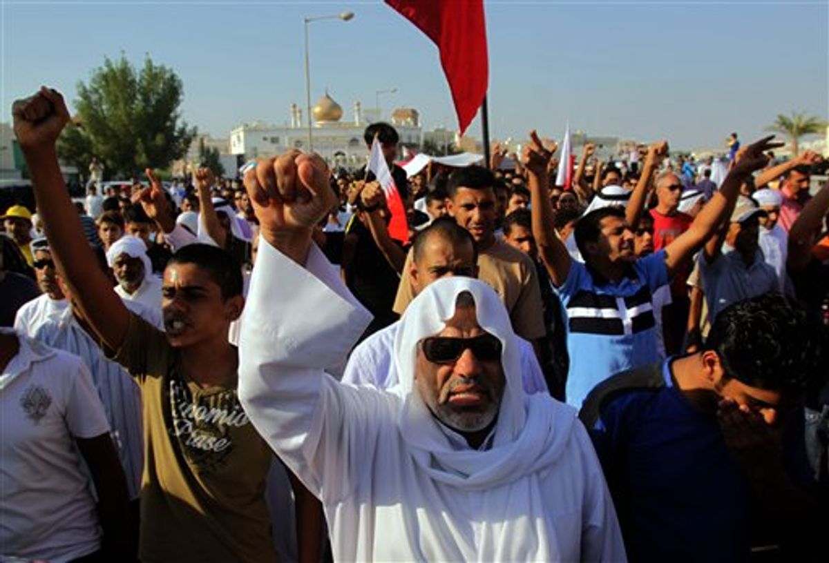 Thousands chant anti-government slogans Sunday, Sept. 18, 2011, in the western village of Dumistan, Bahrain, during the funeral of Jaffar Hasan Yousef, 29, who relatives said had been hospitalized in Bahrain and Jordan since being severely beaten during a house raid allegedly by security forces during the spring crackdown that followed an anti-government uprising. There was no immediate government comment. (AP Photo/Hasan Jamali) (AP Photo/Hasan Jamali)