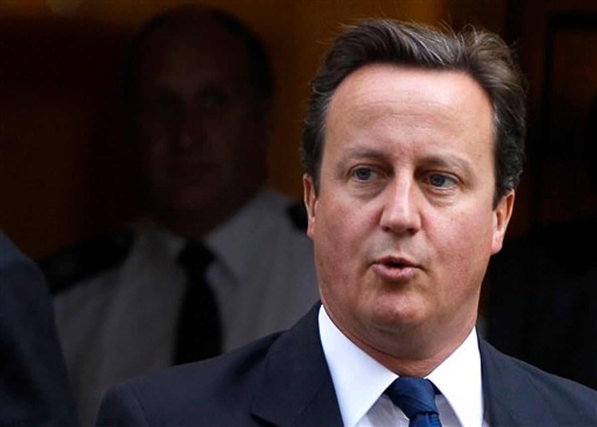 Britain's Prime Minister David Cameron leaves Downing Street in London, to attend the weekly Prime Ministers Questions in Parliament, Wednesday, Sept. 14, 2011. (AP Photo/Kirsty Wigglesworth)    (AP)