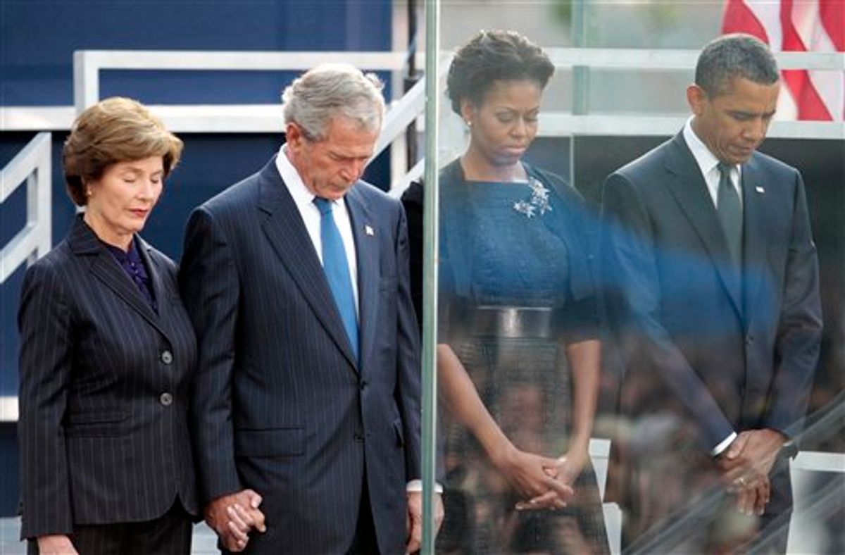 President Barack Obama and first lady Michelle Obama, former President George W. Bush and former first lady Laura Bush bow their heads during a moment of silence at the Sept. 11 10th Anniversary Commemoration Ceremony at Ground Zero in New York, Sunday, Sept., 11, 2011 in New York. (AP Photo/Pablo Martinez Monsivais)  (AP)