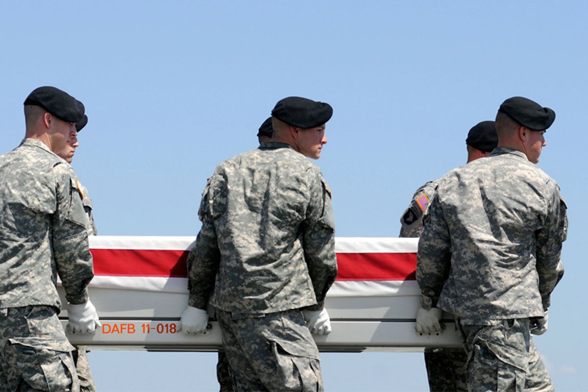 An Army carry team moves a transfer case containing the remains of Sgt. Matthew A. Harmon Wednesday, Aug. 17, 2011 at Dover Air Force Base, Del.