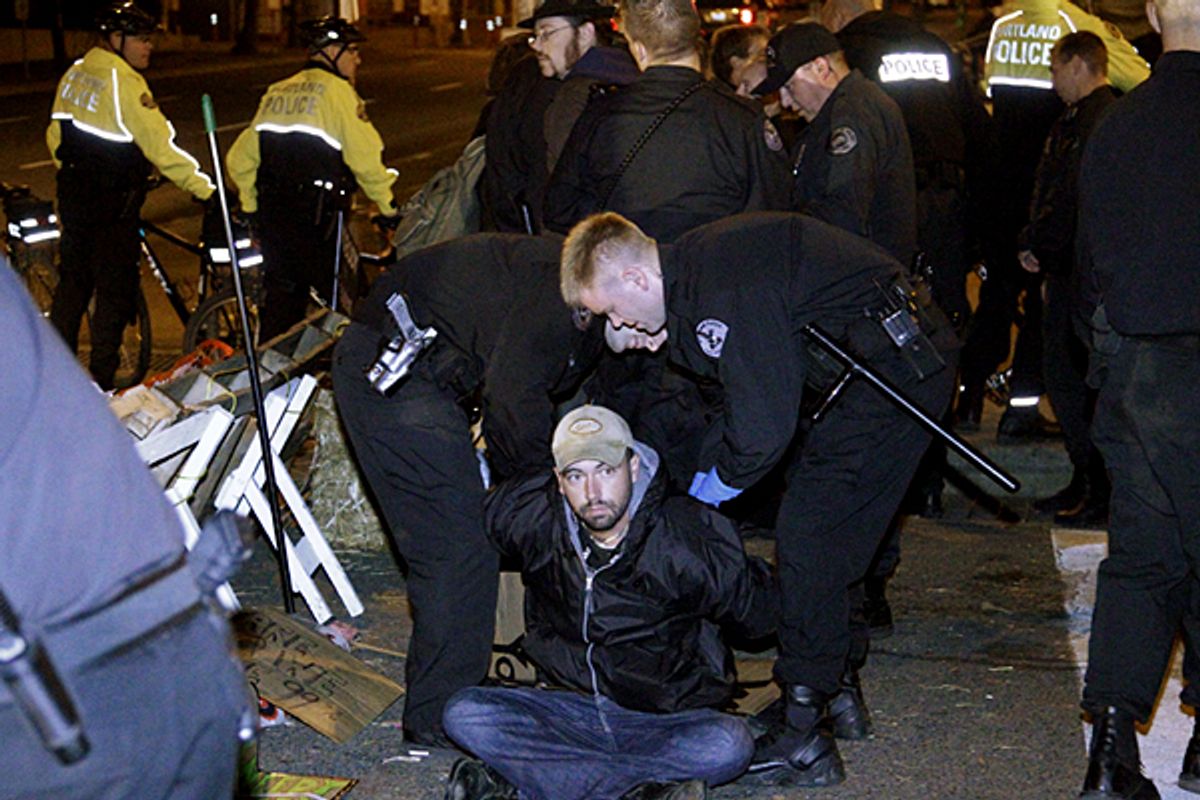 A Occupy Portland demonstrator is arrested on Thursday, Oct. 13, 2011, in Portland, Ore.   (AP/Rick Bowmer)