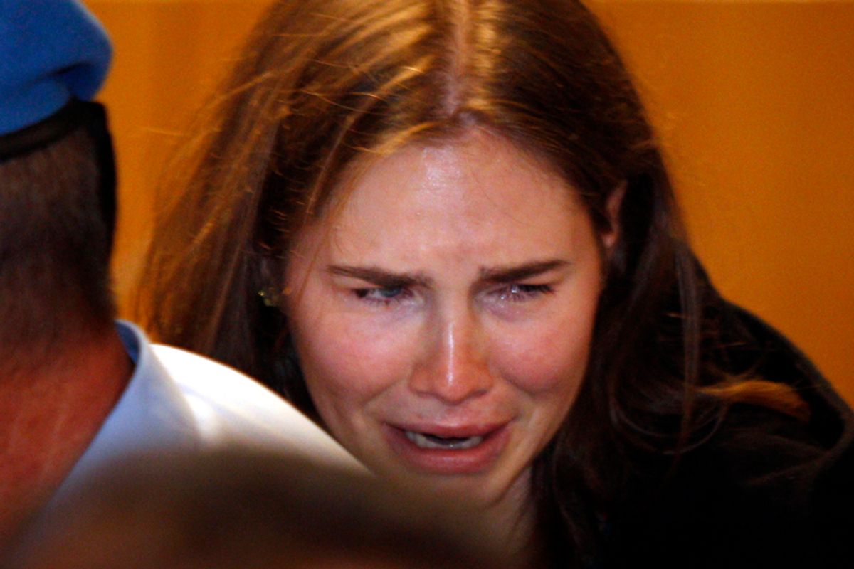 Amanda Knox breaks in tears after hearing the verdict that overturns her conviction and acquits her of murdering her British roommate Meredith Kercher, Monday, Oct. 3, 2011.                (AP/Pier Paolo Cito)