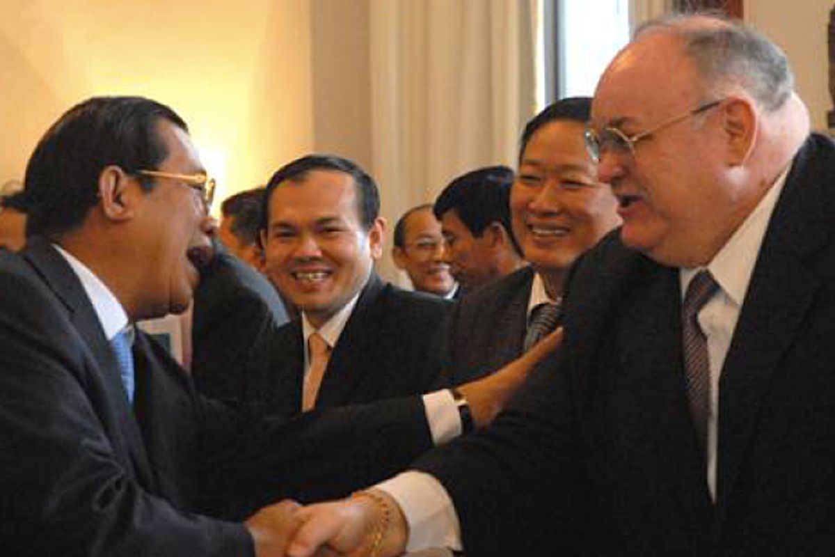  Bretton Sciaroni, right, shakes hands with Cambodian prime minister Hun Sen   