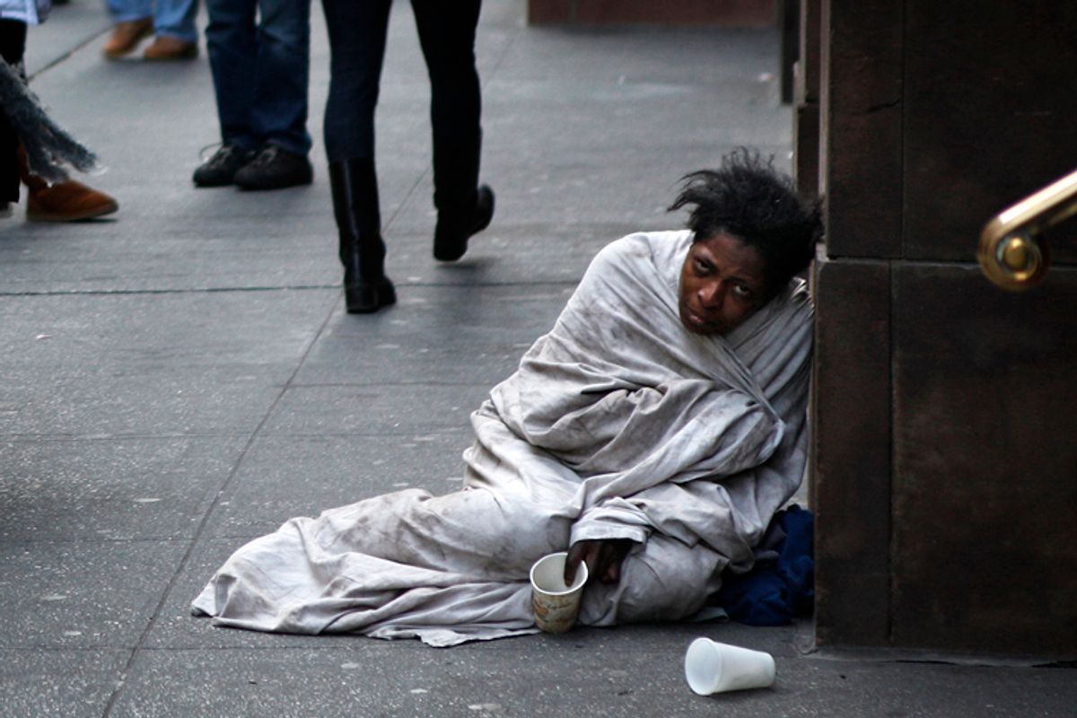 A panhandler begs for money on Fifth Avenue in New York December 8, 2009    (Finbarr O'reilly / Reuters)