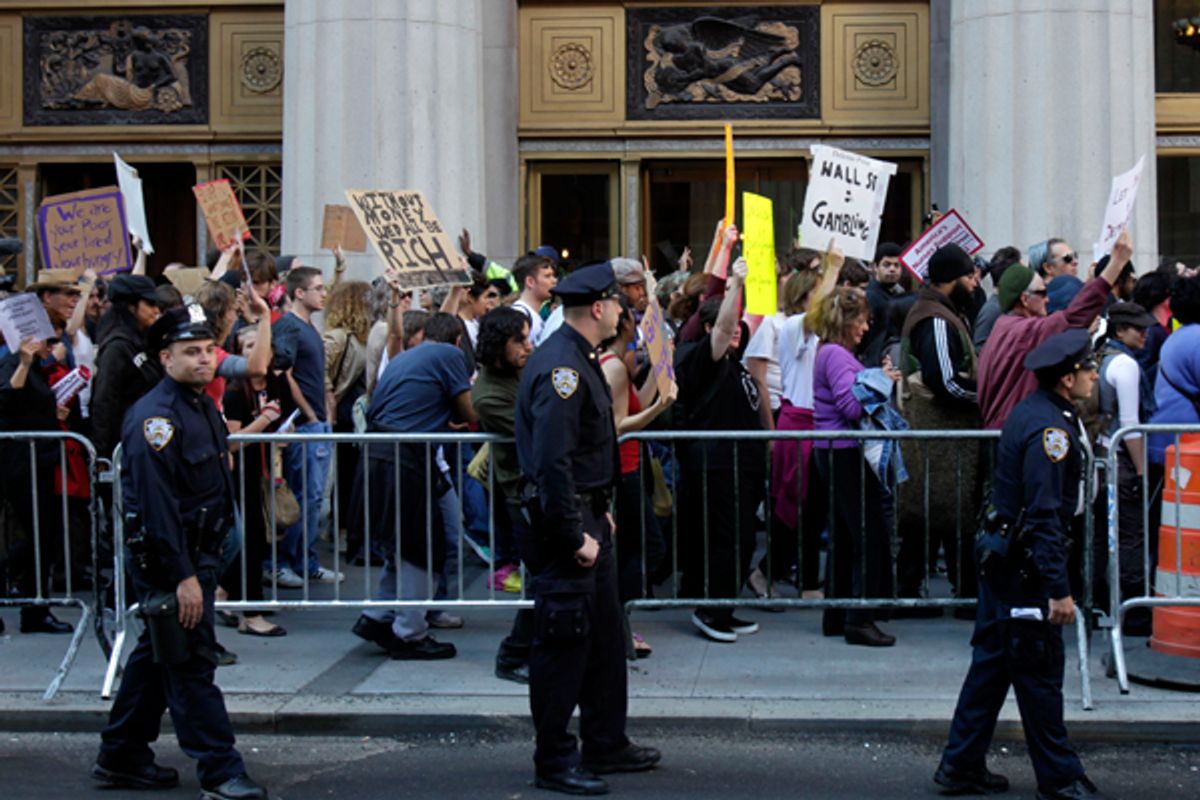  Police escort Occupy Wall Street protesters marching in New York on Wednesday.      (AP/Seth Wenig)