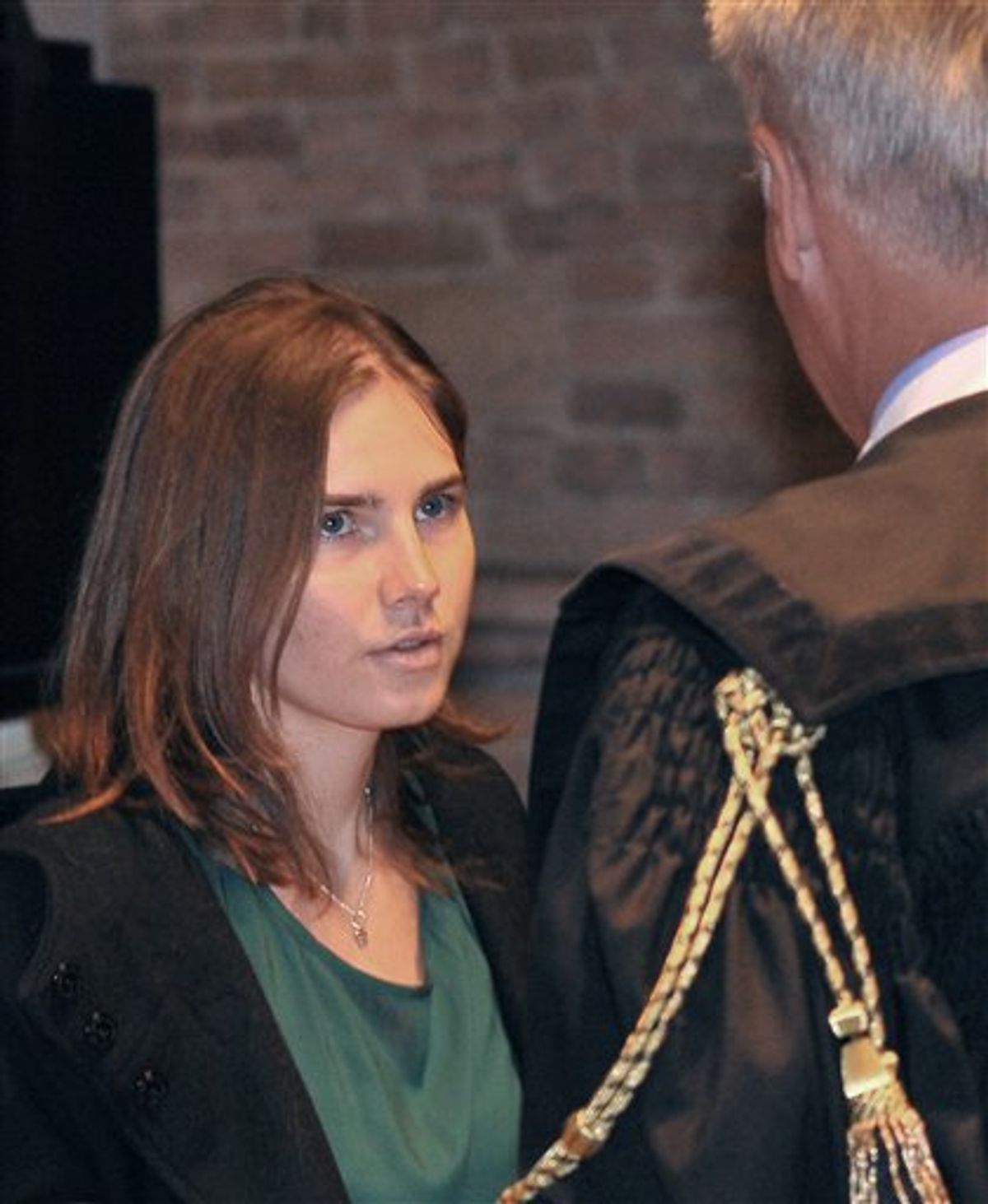 Amanda Knox talks with her lawyer Carlo Dalla Vedova upon arrival for an appeal hearing at the Perugia court, central Italy, Monday, Oct. 3, 2011.        (AP Photo/Antonio Calanni)