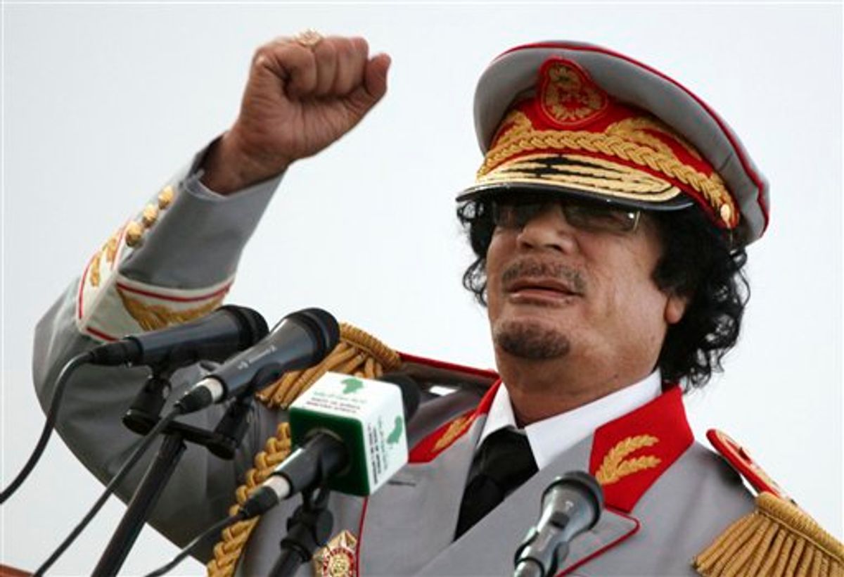 In this Saturday, June 12, 2010 file photo, Libyan leader Moammar Gadhafi talks during a ceremony to mark the 40th anniversary of the evacuation of the American military bases in the country, in Tripoli, Libya.   (AP Photo/ Abdel Magid Al Fergany, File)