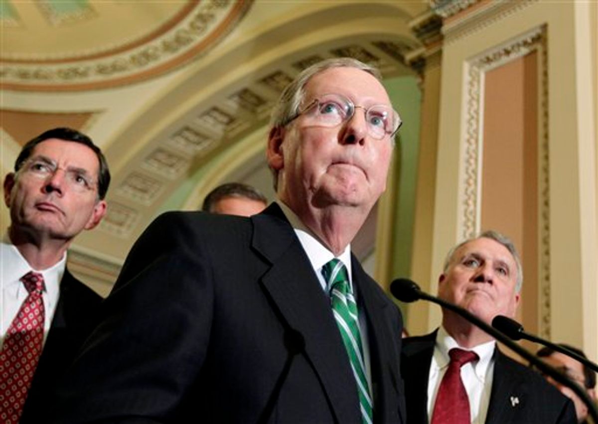 Senate Minority Leader Mitch McConnell of Ky., center, accompanied by Sen. John Barrasso, R-Wyo., left, and Senate Minority Whip Jon Kyl of Ariz., talks about President Obama's job bill, Tuesday, Oct. 4, 2011, during a news conference on Capitol Hill in Washington.  (AP Photo/J. Scott Applewhite)     (AP)