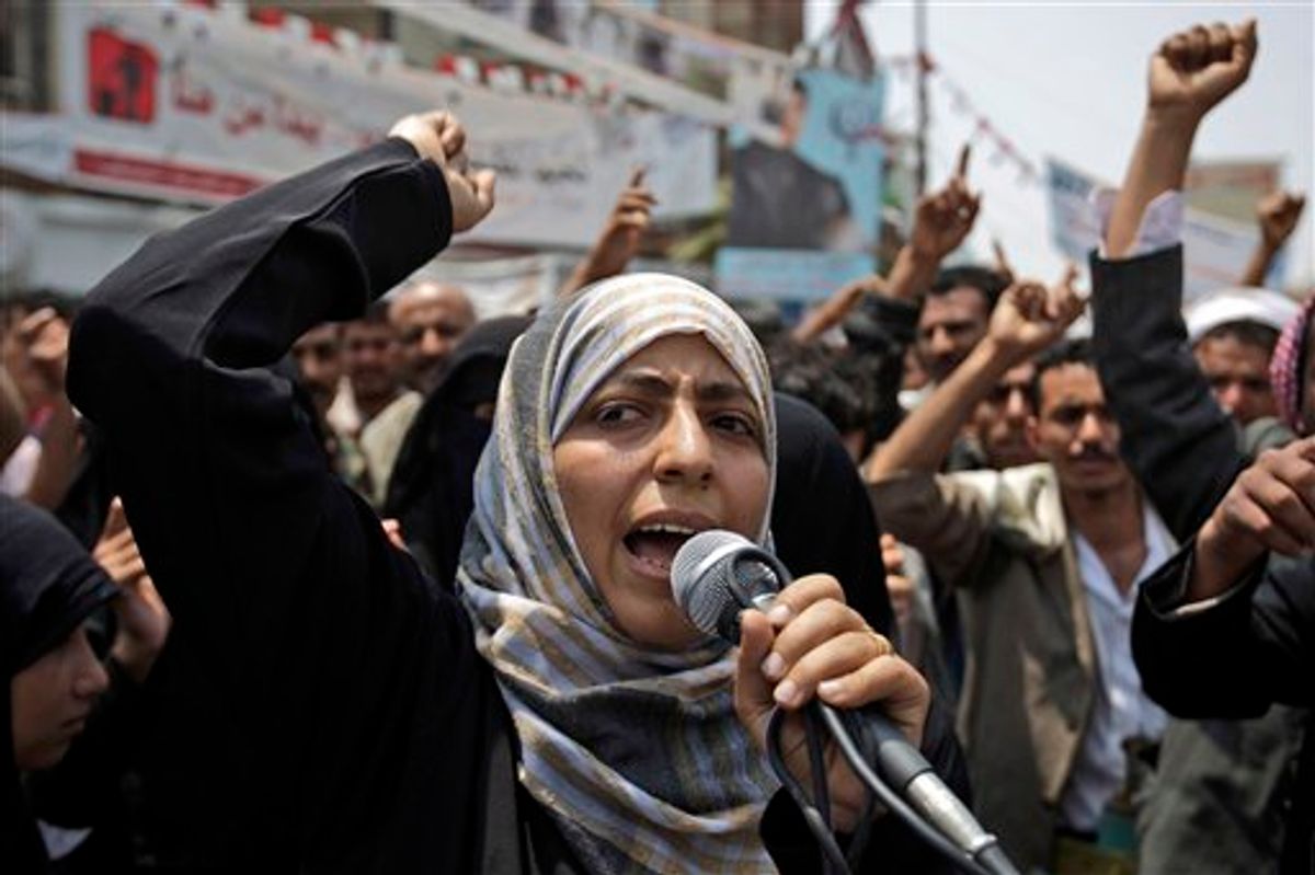 Yemeni activist Tawakkul Karman chants slogans along with anti-government protestors, during a demonstration demanding the resignation of Yemeni President Ali Abdullah Saleh, in Sanaa, Yemen, in June.      (AP/Hani Mohammed)