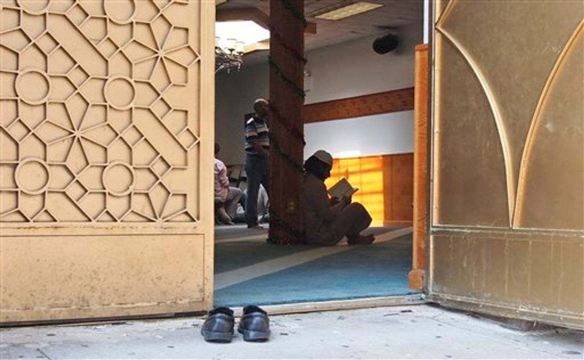 In this photo taken Sept. 2, 2011, worshippers are pictured inside the Al-Iman Mosque after midday prayers in the Astoria neighborhood of the Queens borough of New York.         (AP Photo/Charles Dharapak)