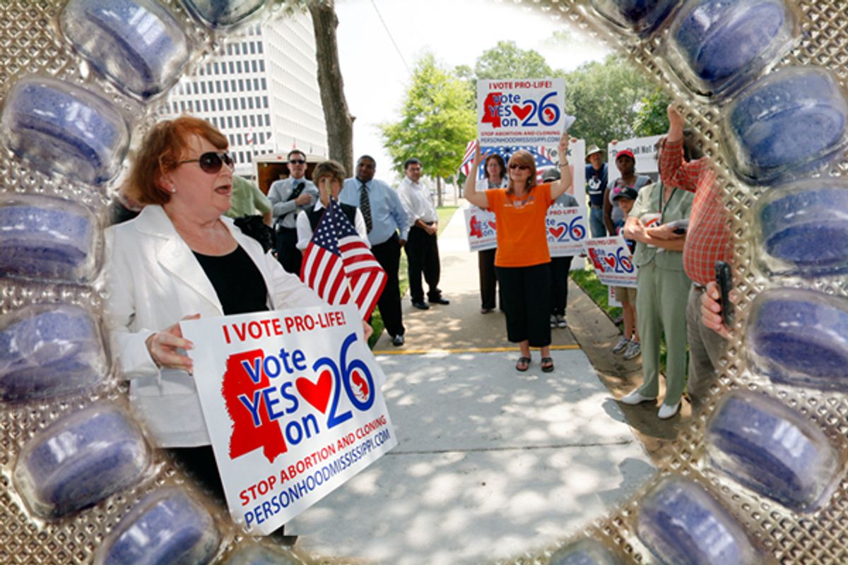 At a June 6, 2011, rally, Dr. Beverly McMillan, president of Pro-Life Mississippi, left, thanks the people gathered in Jackson, Miss., for their support on the state's proposed "personhood" amendment.   (iStockphoto/meltonmedia/AP/Rogelio V. Solis)