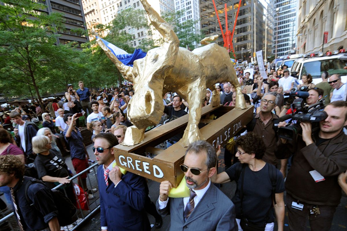  A coalition of clergy carry a "False Idol" to the Occupy Wall Street encampment in Zuccotti Park, Sunday, Oct. 9, 2011 in New York.                 (AP)