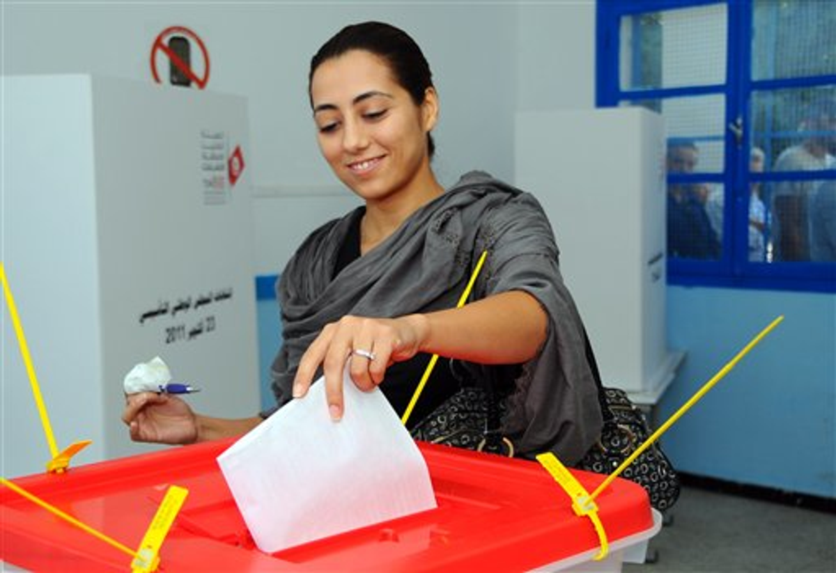  A Tunisian casts her vote in la Marsa near Tunis, Sunday Oct. 23, 2011  (AP Photo/Hassene Dridi)