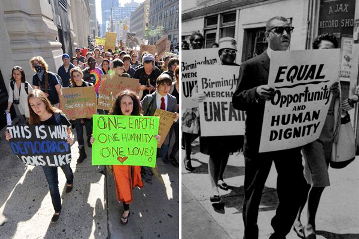 Protesters with Occupy Wall Street march from Zuccotti Park to Washington Square Park in New York, Oct. 8, 2011. Right: Al Hibbler, right, blind black singer, leads a line of sign carrying demonstrators in downtown Birmingham, AL, April 10, 1963.
   (AP)