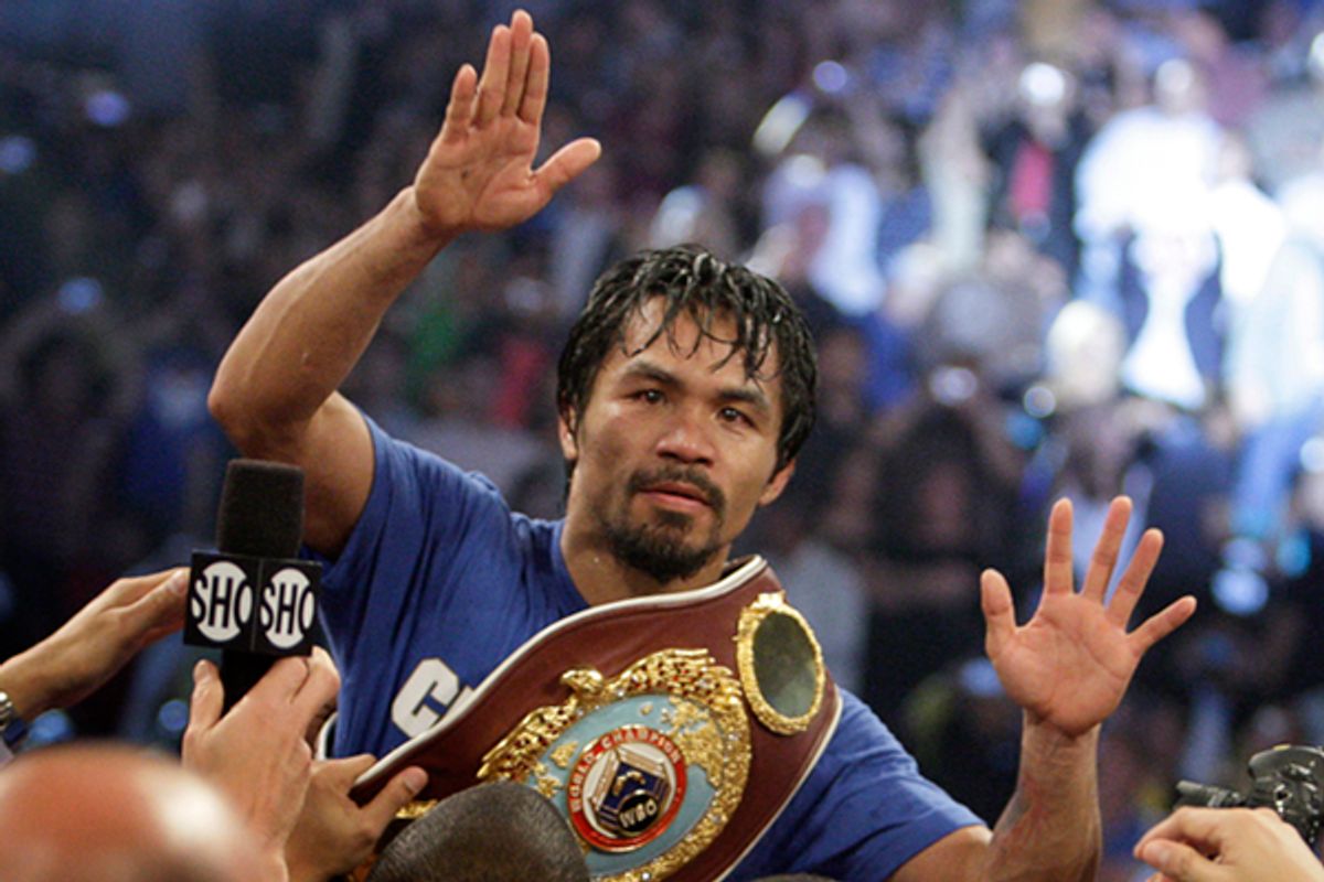 Manny Pacquiao of the Philippines celebrates his victory over Shane Mosley of the U.S. after the WBO welterweight title fight at the MGM Grand Garden Arena in Las Vegas on May 7, 2011.     (Steve Marcus / Reuters)