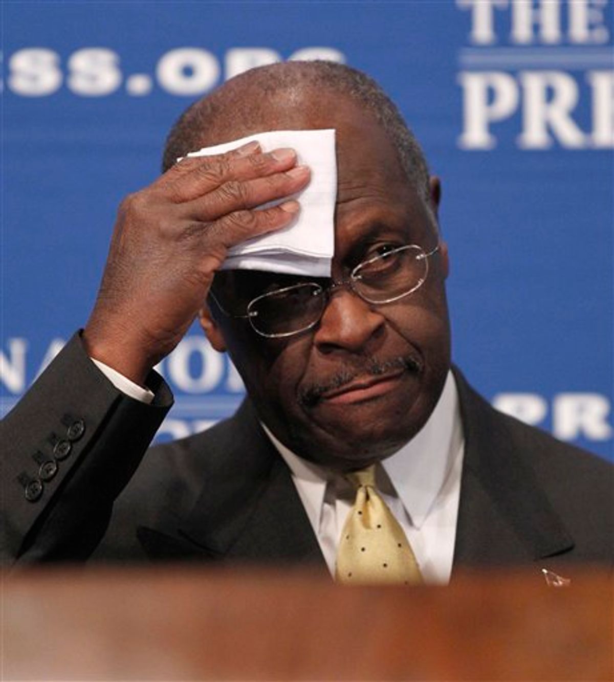 Republican presidential candidate, Herman Cain wipes his forehead before answering questions at the National Press Club in Washington, Monday, Oct., 31, 2011. Denying he sexually harassed anyone, Cain said Monday he was falsely accused in the 1990s while he was head of the National Restaurant Association, and he branded revelation of the allegations a "witch hunt.". (AP Photo/Pablo Martinez Monsivais)  (AP)