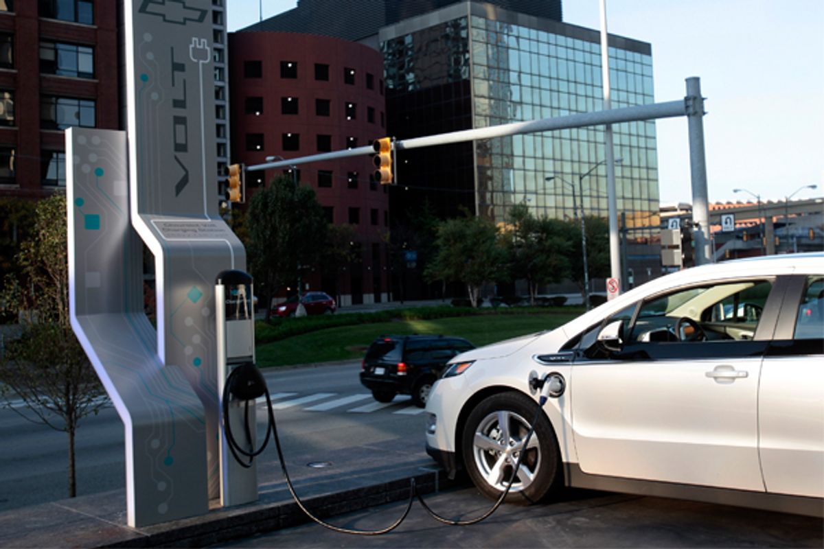 A Chevrolet Volt sits plugged into an electric vehicle charging station outside General Motors world headquarters in Detroit.        (Reuters/Rebecca Cook)