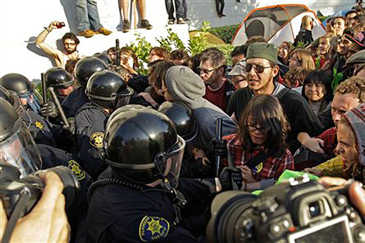 Police in riot gear clash with student activists in front of Sproul Hall on the University of California at Berkeley campus Wednesday, Nov. 9, 2011, in Berkeley, Calif.      (AP/Ben Margot)