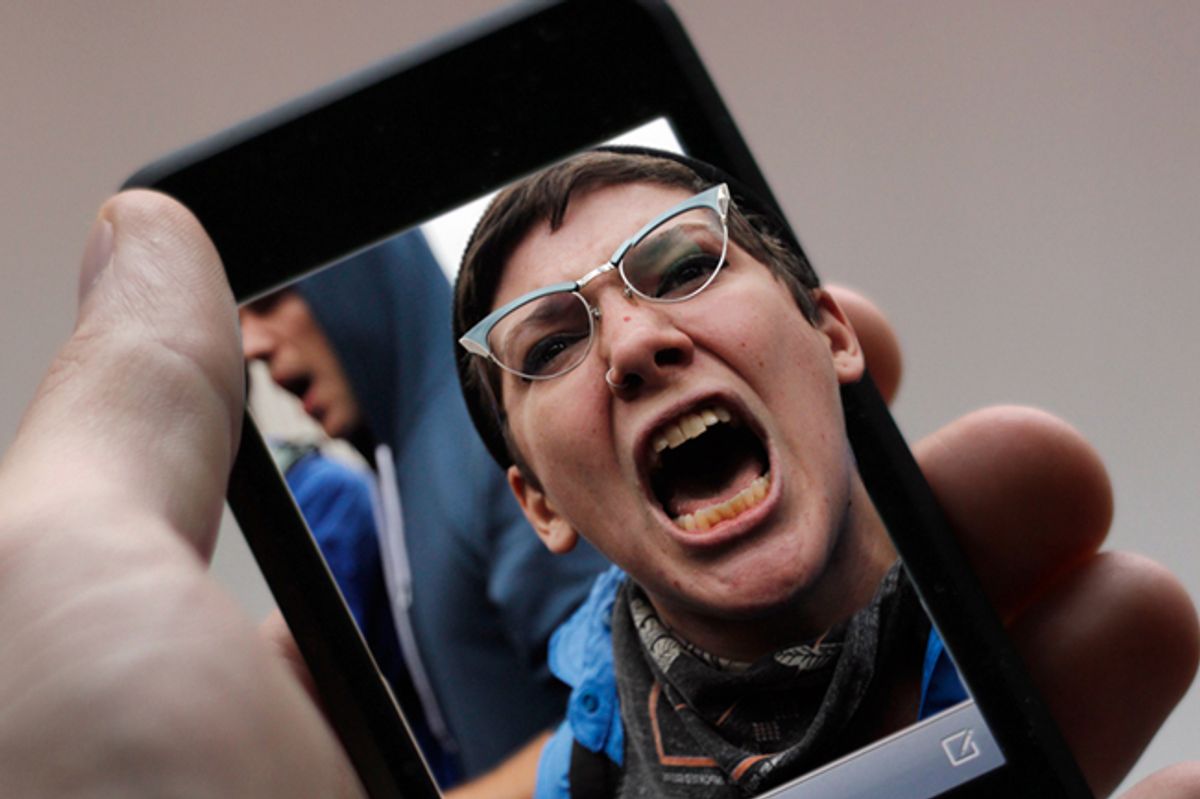  A protester chants during an Occupy Wall Street march in New York.          (<a href='http://www.shutterstock.com/gallery-4961p1.html'>J. Henning Buchholz</a> via <a href='http://www.shutterstock.com/'>Shutterstock</a>/Reuters)