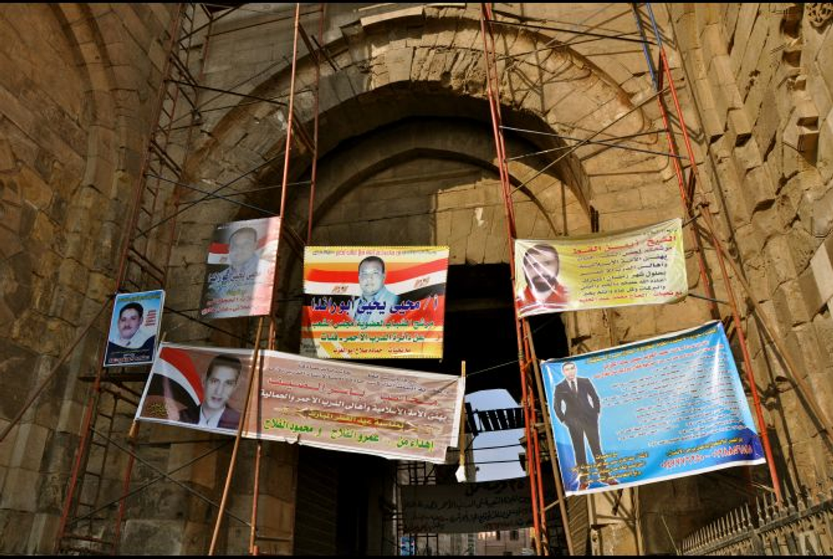 Advertisements for parliamentary candidates hang from scaffolding in Cairo in October 2011    (Lauren E. Bohn/GlobalPost)