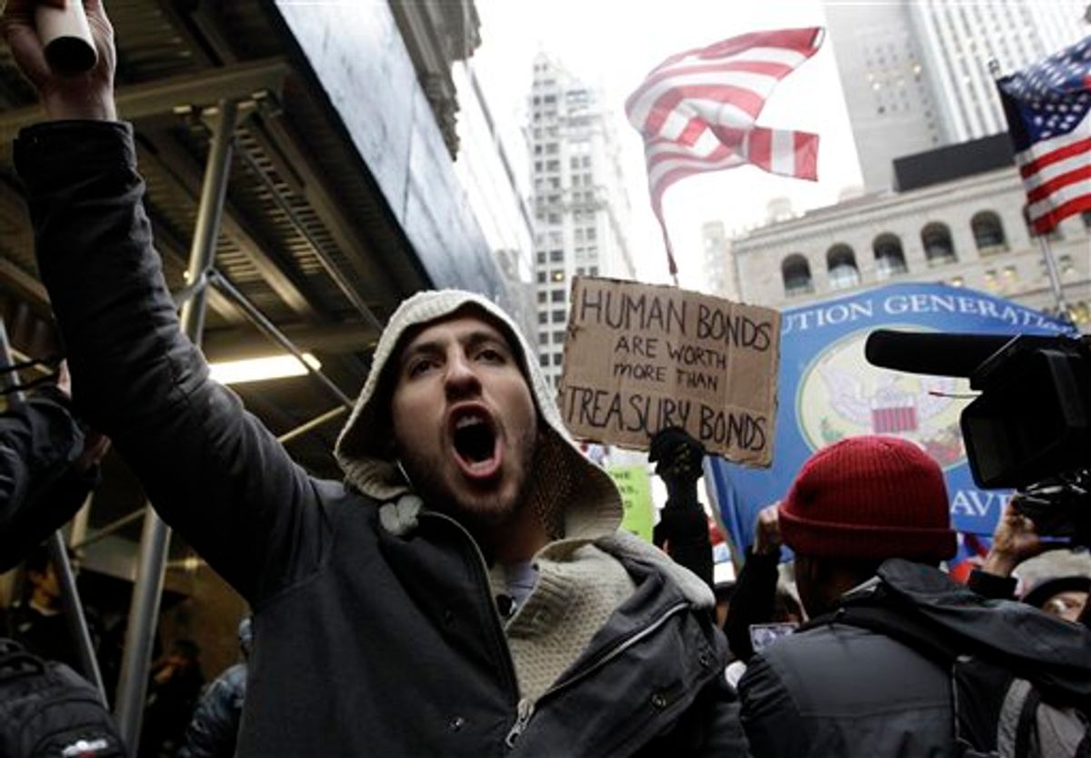 Demonstrators affiliated with the Occupy Wall Street movement march through the streets of the financial district, Thursday, Nov. 17, 2011 in New York.          (AP Photo/Mary Altaffer)