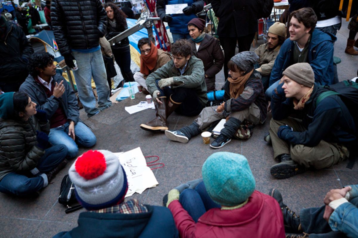 Occupy Wall Street protestors attend a meeting on economic theory in Zuccotti Park.     (AP/John Minchillo)