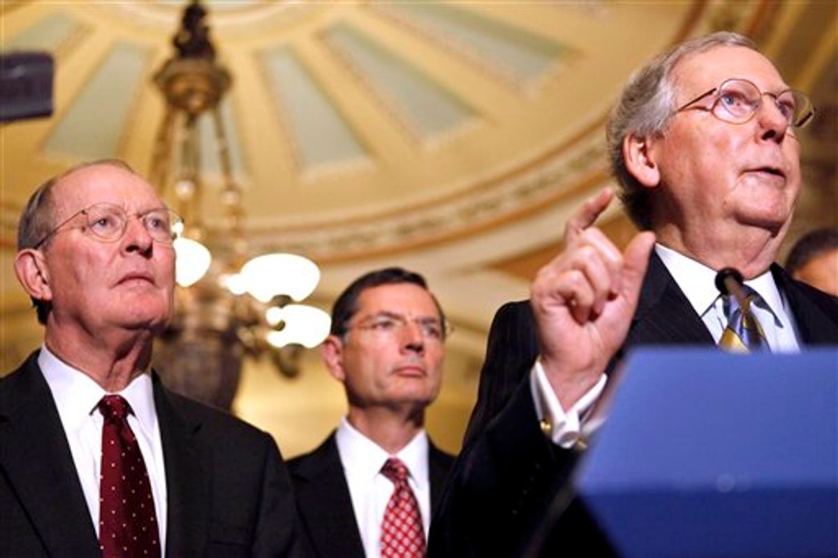 Senate Minority Leader Mitch McConnell, R-Ky., right, accompanied by, from left, Sen. Lamar Alexander, R-Tenn., Sen. John Barrasso, R-Wyo., gestures during a news conference on Capitol Hill in Washington, Tuesday, Oct. 18, 2011.          (AP/Jacquelyn Martin)