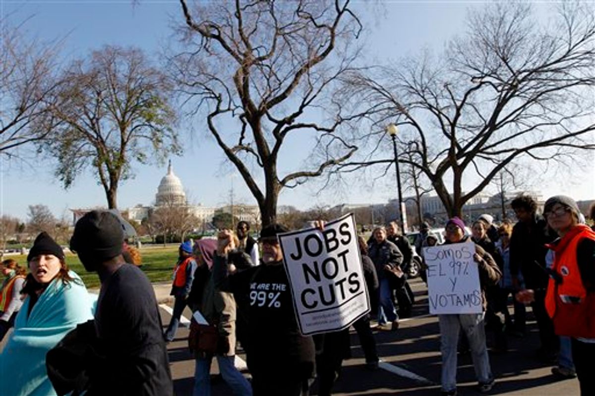 Demonstrators chant for jobs outside on Capitol Hill in Washington, Thursday Dec. 8, 2011. Dozens of activists protesting the U.S. government's failure to help the unemployed are marching to the Capitol to pray for and shout at members of Congress _ above all, the leader of the House, Speaker John Boehner. (AP Photo/Jose Luis Magana)                       (AP)