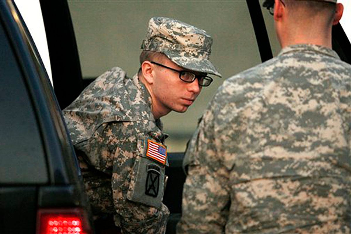 Army Pfc. Bradley Manning is escorted from a security vehicle to a courthouse in Fort Meade, Md., Monday, Dec. 19, 2011, for a military hearing         (AP/Patrick Semansky)