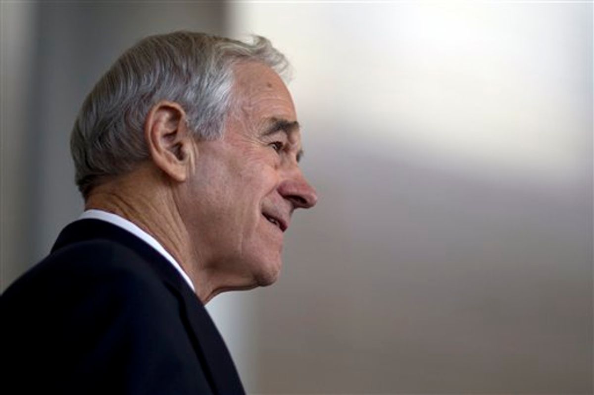 Republican presidential candidate Texas Rep. Ron Paul pauses during a campaign stop on Monday, Jan. 2, 2012, in Cedar Rapids, Iowa.  (AP Photo/Evan Vucci)        (AP)