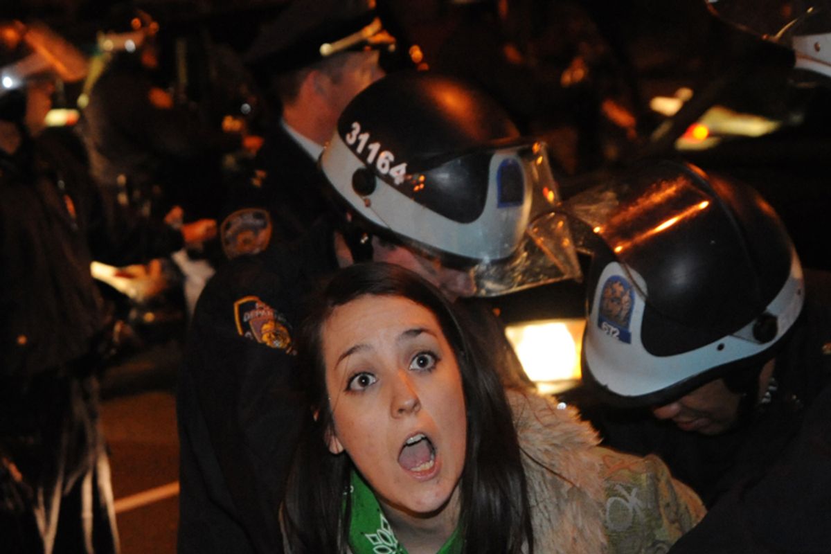 An Occupy Wall Street protester is arrested by police Sunday Jan. 1, 2012 in New York.        (AP/Stephanie Keith)