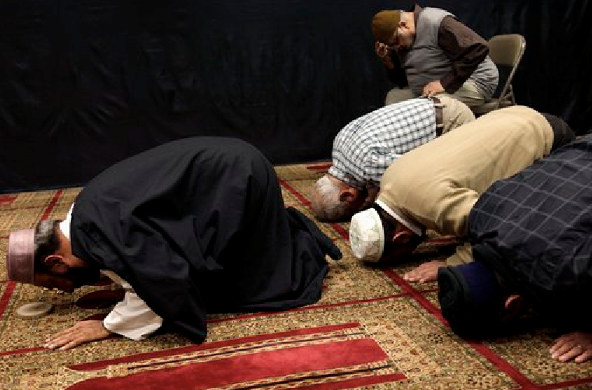 Imam Malik Sakhawat Hussain, left, leads prayers at the Al-Mahdi Foundation in New York, Wednesday, Feb. 1, 2012. The New York Police Department recommended increasing surveillance of thousands of Shiite Muslims and their mosques based solely on their religion,       (AP Photo/Seth Wenig)