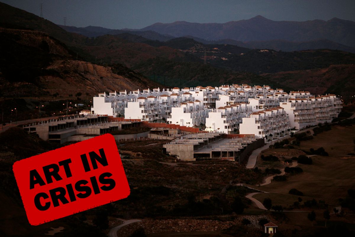 An unfinished residential building (left) is seen on a mountain in Estepona, near Malaga, southern Spain, Jan. 31, 2012.        (Jon Nazca / Reuters)