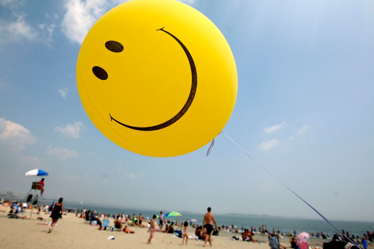  A smiley-face balloon floats over Revere Beach in Revere, Mass.      (AP)