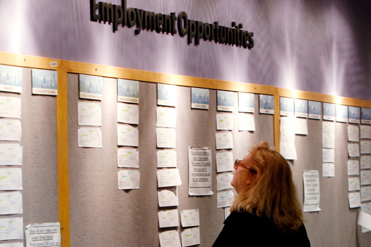 Lori Kamlet looks at posted employment opportunities at a Denver employment office.      (AP)