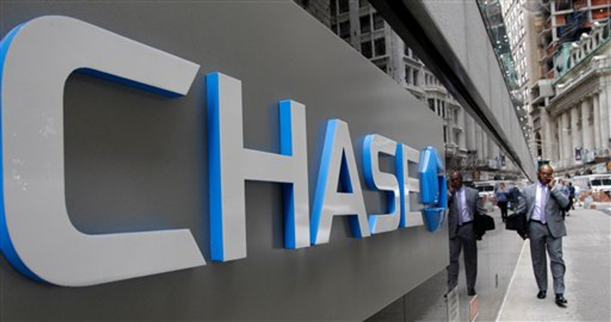  This Oct. 12, 2011 file photo shows the J.P. Morgan Chase logo at the base of one of the bank's larger Lower Manhattan buildings in New York    (AP Photo/Kathy Willens)
