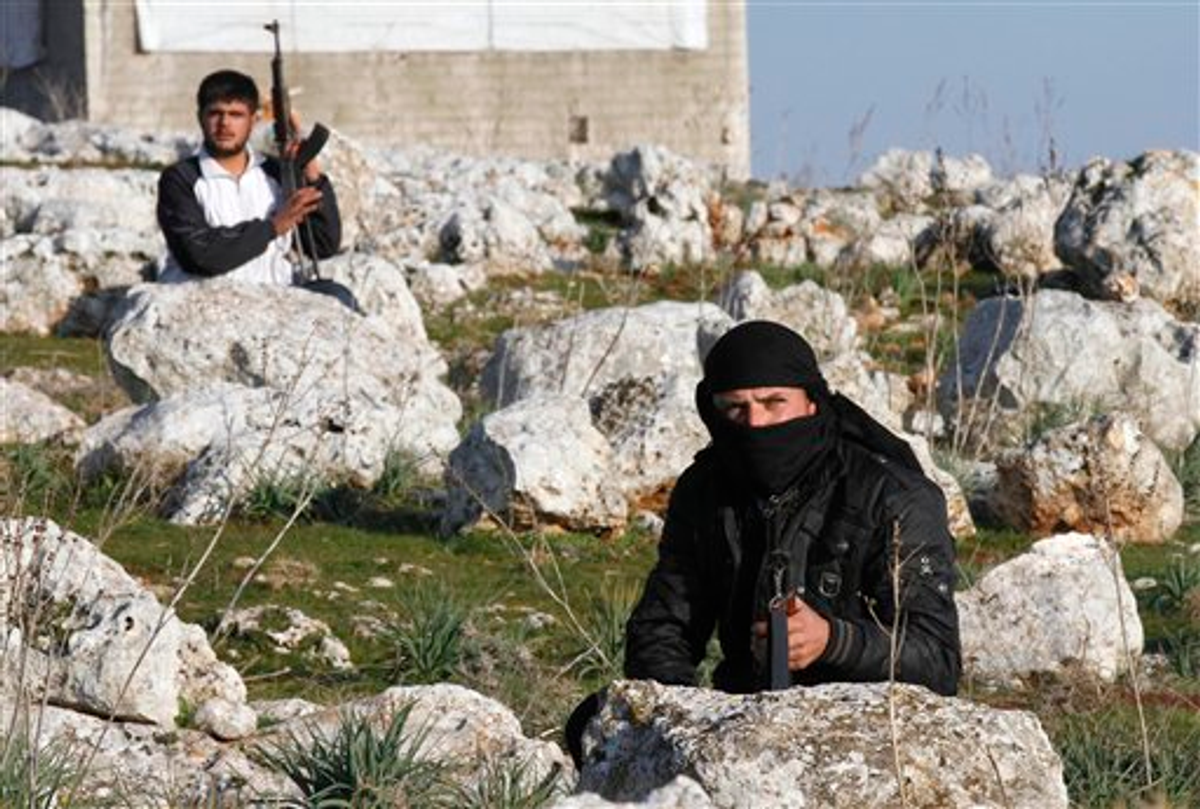 Syrian rebels are seen outside of Idlib, Syria, Saturday, Feb. 11, 2012 (AP)