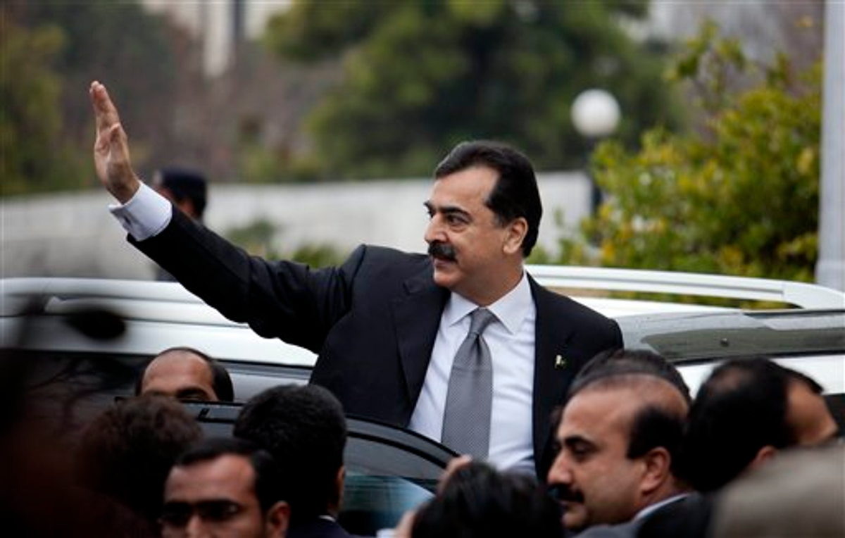 Pakistani Prime Minister Yousuf Raza Gilani waves upon his arrival at the Supreme Court for a hearing in Islamabad, Pakistan, Monday, Feb. 13, 2012 (AP Photo/B.K. Bangash)