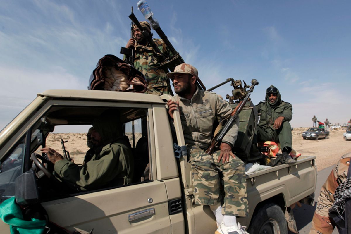 Libyan rebels head towards the front line outside the eastern town of Brega, Libya Friday, April 1, 2011       (AP)