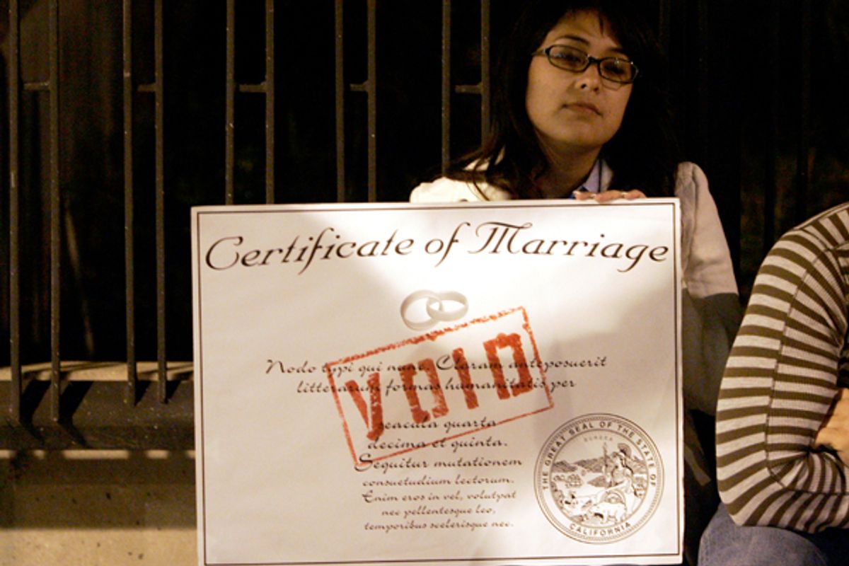 A protester holds a mock marriage certificate while demonstrating during an anti-Proposition 8 rally in Los Angeles.   (Reuters/Danny Moloshok)