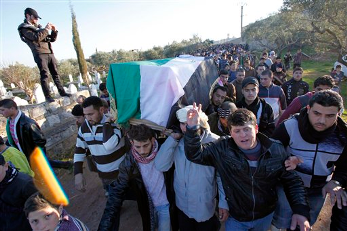 In this Saturday, Feb. 4, 2012 photo anti-government protesters carry the coffin of a slain proteste in Idlib, north Syria      (AP)