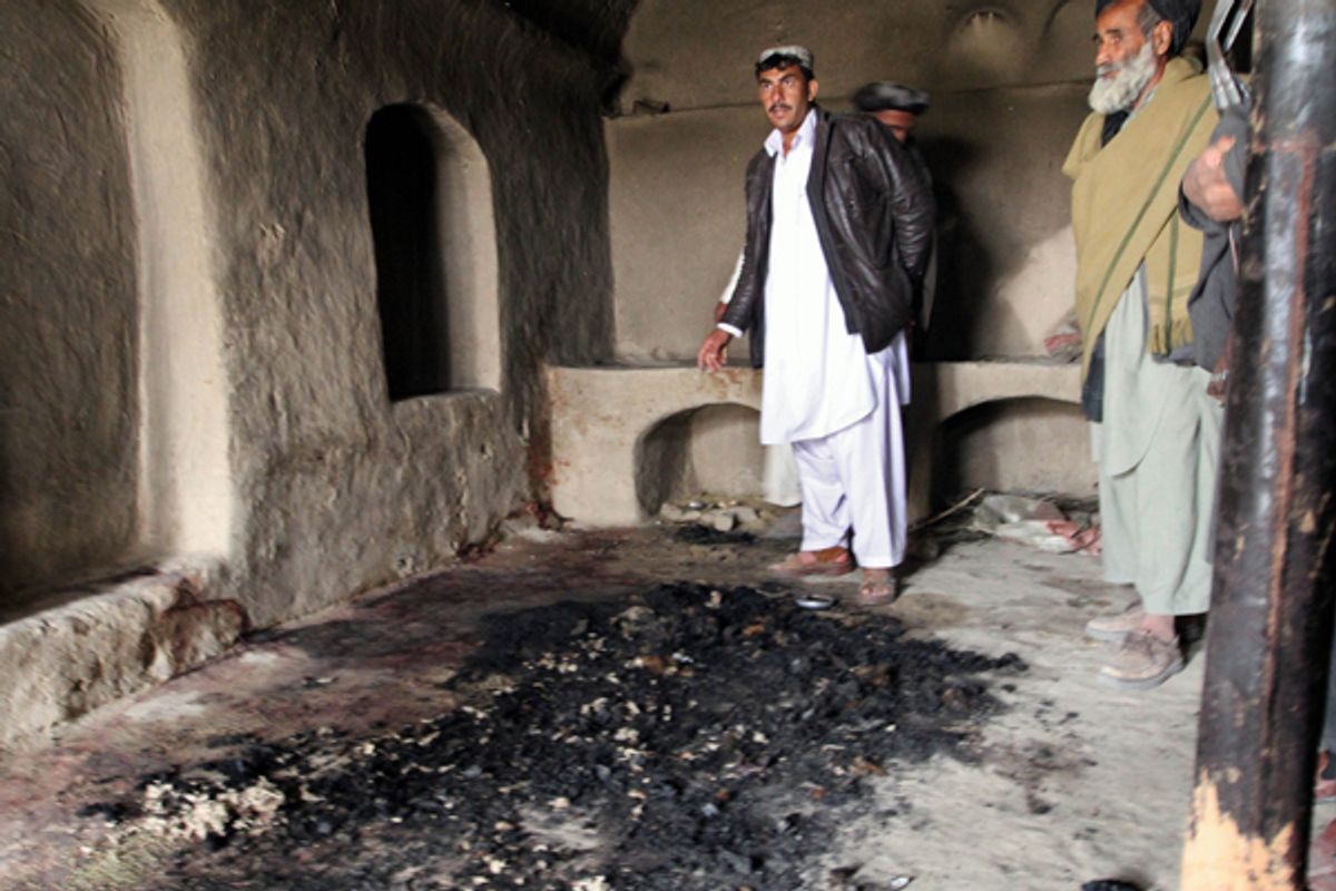 Blood stains and charred remains are all that remains inside a Kandahar home where witnesses say a family of Afghans was slain by a U.S. soldier.   (AP/Allauddin Khan)