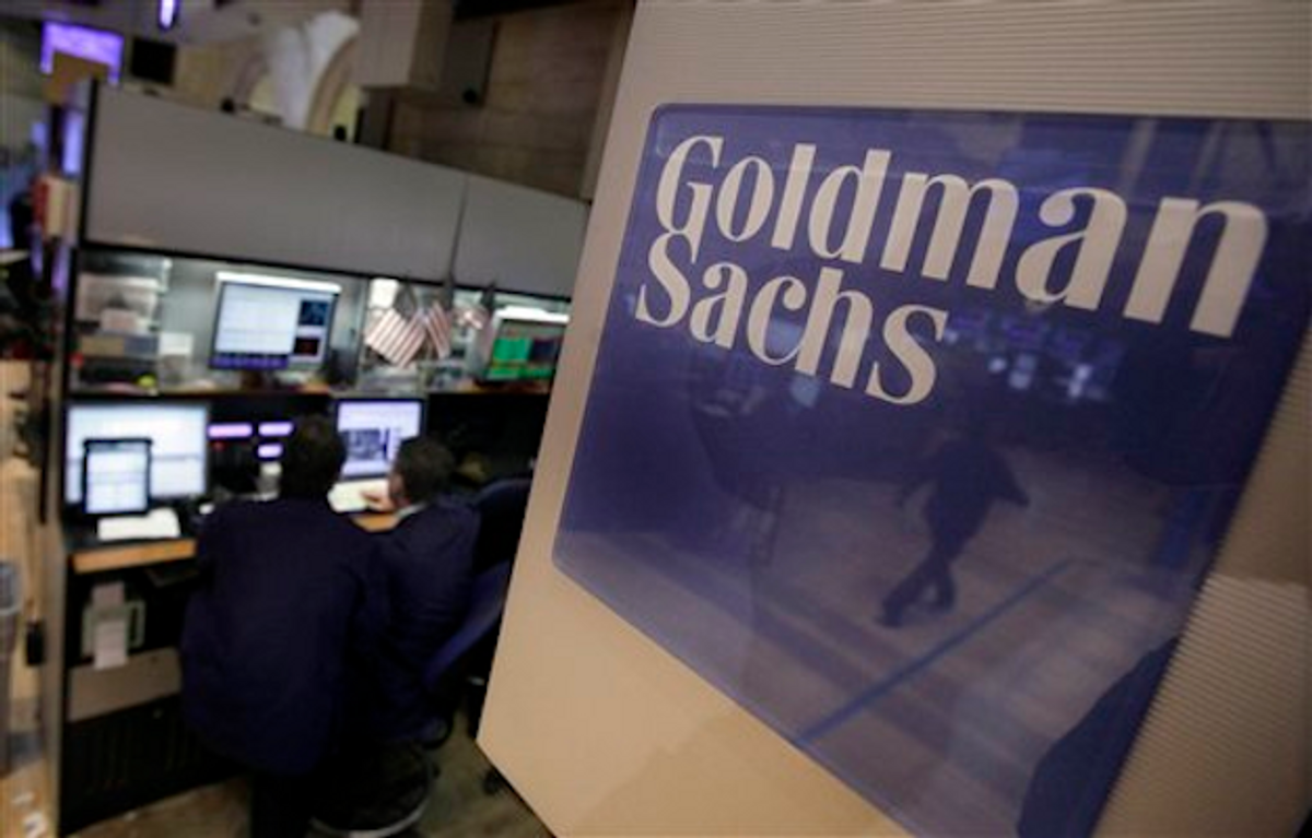  Traders work in the Goldman Sachs booth on the floor of the New York Stock Exchange Thursday, March 15, 2012        (AP Photo/Richard Drew)