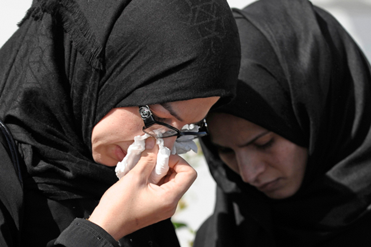 Women in mourning cry outside a memorial service for Shaima Alawadi in Lakeside, Calif. March 27, 2012.     (Reuters/Denis Poroy)