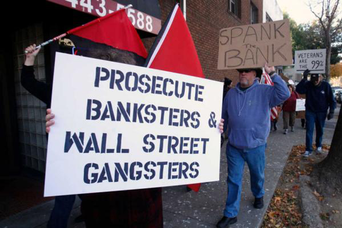  Members of Occupy Sacramento march through downtown Sacramento as part of the "National Day of Action to Stop and Reverse Foreclosures," Tuesday, Dec. 6, 2011       (AP/Rich Pedroncelli)