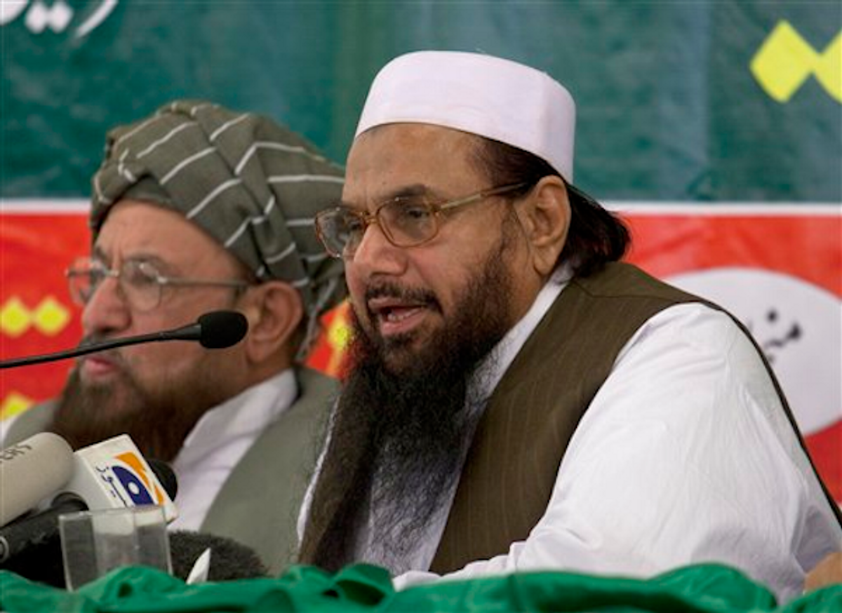 Hafiz Mohammad Saeed, right, chief of Jamaat-ud-Dawwa and founder of Lashkar-e-Taiba, addresses a news conference with anti-American cleric Sami ul Haq in Rawalpindi, Pakistan on Wednesday, April 4, 2012.    (AP Photo/B.K. Bangash)